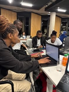 Young African intern gaining workplace experience in an office