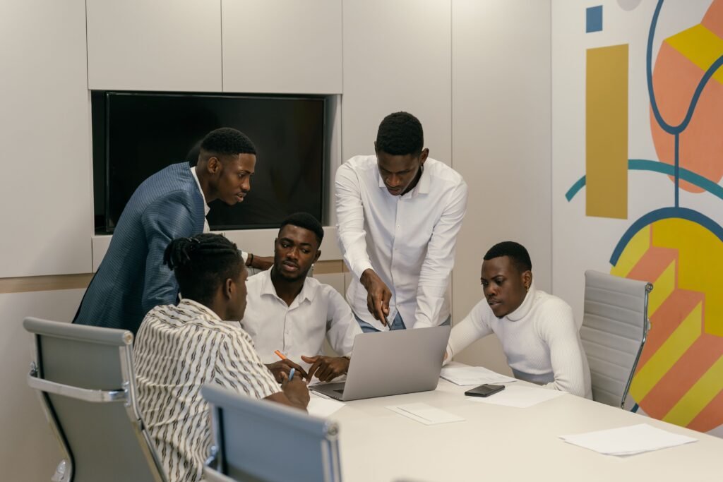African professionals working together with digital technology