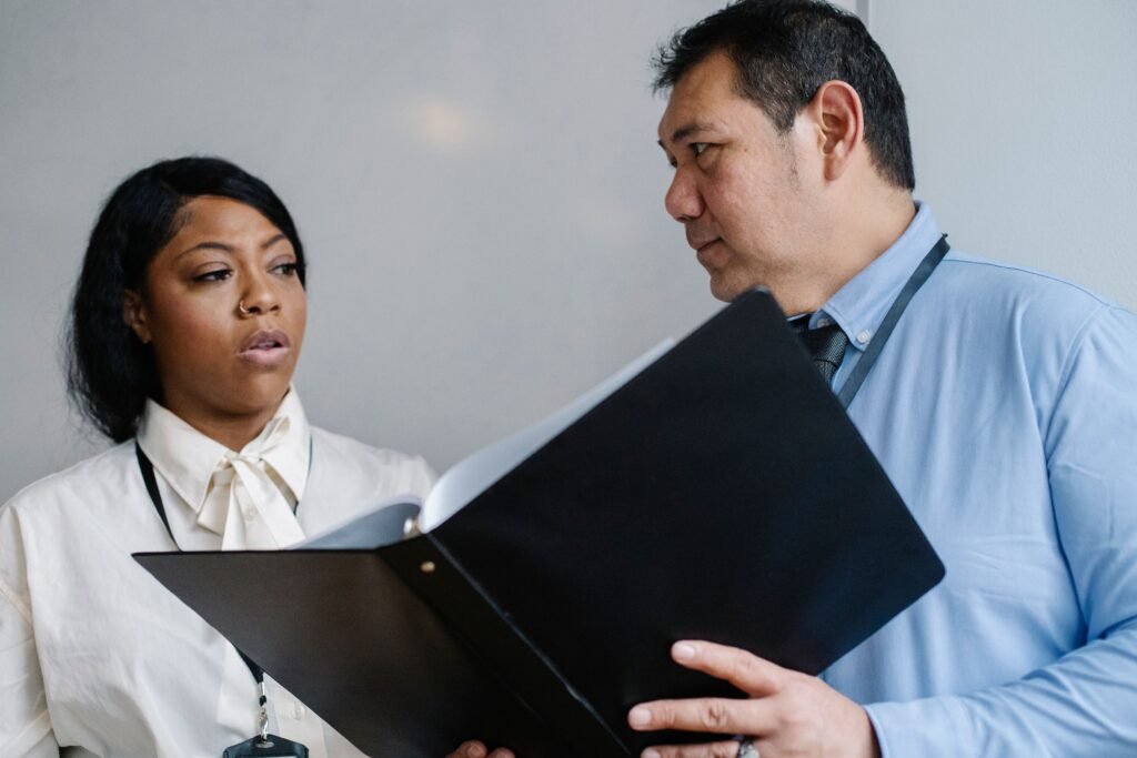 Young professionals reviewing work and presenting evidence of their skills
